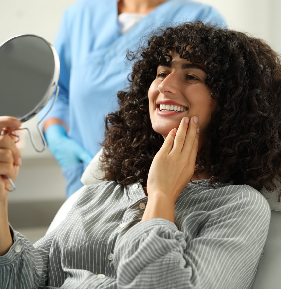 Smiling woman outside with healthy teeth